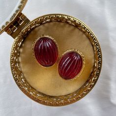 Very good vintage condition, signed, heavy with red glass cabochon. Rare find.Disclaimer: This item is an Estate/Antique Sale/Fair Find. Item is described to the best of my ability. Please contact me if you have any questions or wish to see additional photos prior to buying. Thank you! Vintage Oval Cabochons For Formal Occasions, Traditional Red Oval Earrings, Traditional Oval Red Earrings, Vintage Oval Gold Cabochons, Retro Red Clip-on Earrings For Formal Occasions, Retro Red Formal Earrings, Retro Red Earrings For Formal Occasion, Red Retro Earrings For Formal Occasions, Victorian Red Oval Cabochon Jewelry