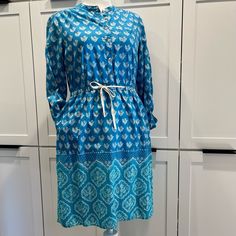 Anthropologie/ Meadow Rue - Blue Ikat Print Long Sleeve Cotton Dress / Size 8 Never Worn, Lightweight Blue Dress With Pretty Blue And White Ikat Print. Cinched Waist, Mother Of Pearl Button Top, Sleeves Can Be Worn Down Or Buttoned Up With Attached Strap Mid-length Blue Cotton Dress, Blue Mid-length Dress For Daywear, Light Blue Casual Tunic Dress, Casual Light Blue Tunic Dress, Casual Blue Midi Dress With Tie Waist, Blue Long Sleeve Midi Dress With Tie Waist, Blue Daywear Dress With Tie Waist, Blue Tie Waist Dress For Daywear, Blue Dresses With Tie Waist For Daywear