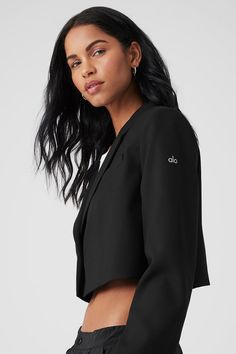 You’ll own the office—and the streets—in this cute, cropped-at-the-waist blazer. It has all the classic details you know and love, like notched lapels, a single-button front and subtle shoulder pads. The fit is slightly oversized and boxy for a cool, menswear-inspired look. Wear it with bike shorts, trousers, baggy jeans… This blazer does it all. Trousers Baggy, Waist Blazer, Menswear Inspired, Alo Yoga, Black Blazers, Baggy Jeans, Bike Shorts, First Class, The Streets