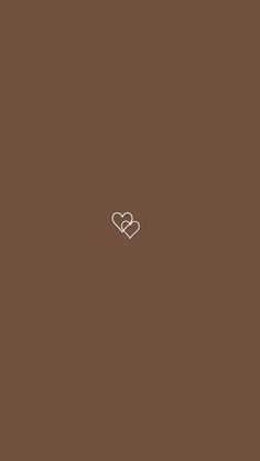 two hearts on a brown background with the word love written in white across the middle