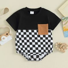 Your little critter will be the most dapper on the block in this OLIVER Checkered Short-Sleeve Onesie! Perfect for summer, this onesie is perfect for your little man no matter what his summer adventure holds! Available in two colors, he's sure to look as handsome as he is handsomely comfortable! Playful Black Short Sleeve Onesie, Family Matching Black Cotton Onesie, Black Cotton Onesie For Spring, Spring Cotton Black Onesie, Black Short Sleeve Onesie For Summer, Spring Black Cotton Onesie, Black Cotton Onesie For Summer, Black Short Sleeve Onesie For Family Matching, Family Matching Black Short Sleeve Onesie