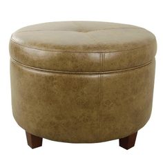 a round ottoman with wooden legs and leather upholstered cushion on an isolated white background