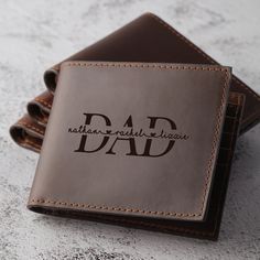 "This wallet is a classic design bifold allowing you to carry your cash and cards. You can personalized with your loved name and meaningful message to create a one of a kind, unforgettable gift. It willbe the perfect gift for Anniversaries, Birthdays, Valentines Day, Father's Day, Christmas and more! P R O D U C T ∙ I N F O * Personalization - Front: By default, big \"DAD\" is in background. You can personalized with your kid names in front of \"DAD\" - Inside: your message * Regardless of wheth Personalized Leather Trifold Wallet Gift, Personalized Classic Leather Wallets, Classic Personalized Leather Wallets, Father's Day Rectangular Wallets With Card Slots, Classic Trifold Wallet For Father's Day And Everyday Use, Classic Trifold Wallet For Everyday Use And Father's Day, Personalized Rectangular Trifold Wallet, Personalized Rectangular Leather Wallet, Personalized Brown Leather Trifold Wallet