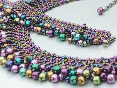 a multicolored beaded necklace and earring set