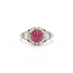 A cabochon ruby weighing approximately 3 carats is set in a platinum mounting accented with round diamonds totaling approximately 0.40 carat. Circa 1920s. Fine Jewelry Cabochon Ruby Ring In White Gold, Fine Jewelry Ruby Cabochon Ring In White Gold, Fine Jewelry White Gold Cabochon Ruby Ring, Fine Jewelry White Gold Ruby Ring With Cabochon, Classic Diamond Ring With Cabochon Cut, Classic Diamond Cabochon Ring, Classic White Gold Cabochons For Anniversary, Classic Diamond Cabochons For Anniversary, Classic Round Cabochon Ruby Ring