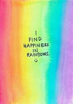 the words i find happiness in rainbows are written on a piece of colored paper