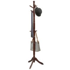 a coat rack with an umbrella and hat hanging on it's side, against a white background