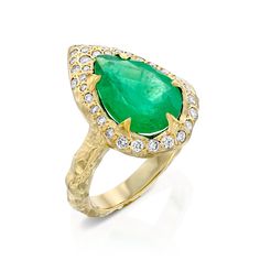 Mystic Eden ringDescription: With its mesmerizing deep green color, this stunning ring stands out and exudes glamour and luxury.. Like an alluring work of art, this emerald ring boasts an irresistible deep green hue that radiates a celestial feel. Materials Description:- 14k Gold.- 3.5 ct Pear-shaped vibrant Emerald.- 0.33 ct Diamonds.- Rough texture, high polis. Emerald: The stone of a mighty heart.Emerald, with its remarkable, eye-catching deep color became known as the stone that attracts mig Green Emerald Diamond Ring With Pave Setting, Green Emerald Ring With Pave Setting, Luxury Green Sapphire Promise Ring, Green Rings With Pave Setting For Formal Occasions, Green Pave Setting Rings For Formal Occasions, Formal Green Rings With Pave Setting, Green Diamond Rings With Pave Setting, Oval Emerald Rings With Pave Setting, Luxury Green Emerald Ring With Bezel Setting