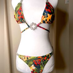 Floral Bikini With Jewels Size Small Never Worn Tropical Print Beachwear For Parties, Tropical Swimwear For Beach Season Party, Fitted Tropical Print Swimwear For Party, Tropical Party Swimwear, Tropical Tie-side Bottom Swimwear For Parties, Tropical Party Swimwear With Tie-side Bottom, Patterned Floral Beachwear Swimwear, Colorful Floral Print Beachwear Swimwear, Festival Floral Print Swimwear Beachwear