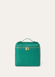 This new backpack version of the iconic Extra Pocket bag is updated with a compact, square shape that is elongated at the bottom. It is crafted from luxury, lightly hammered calfskin with a striking, naturally soft texture and appearance. A minimalist, versatile accessory for the modern, dynamic woman who seeks laidback elegance, down to the tiniest details. High-end Green Box Bag, High-end Travel Box Bag With Removable Pouch, High-end Box Bag With Top Carry Handle For Travel, High-end Rectangular Travel Backpack, Luxury Square Box Bag For Travel, Luxury Rectangular Box Bag For Travel, High-end Box Bag With Detachable Strap For Travel, Elegant Green Box Bag For Travel, Green Rectangular Leather Backpack With Detachable Strap