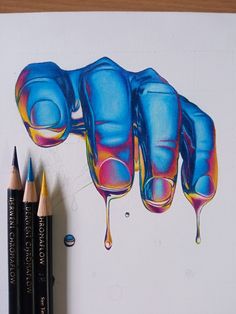 colored pencils are next to a drawing of three glasses with liquid flowing down them