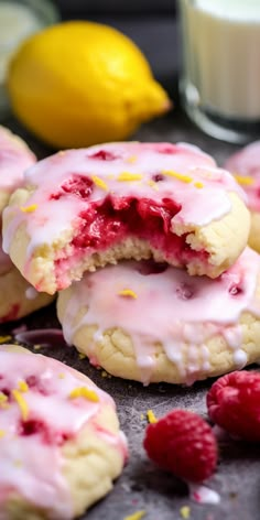 raspberry lemonade cookies with white frosting and fresh raspberries