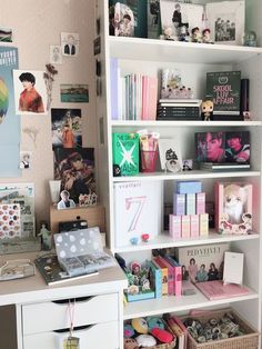 a white book shelf filled with lots of books