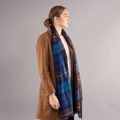 Luxury Extra Fine Merino Stole 'Buchanan Blue Tartan' This beautiful extra fine merino stole is truly versatile. It is lightweight yet can be worn throughout the seasons. Perfect for keeping the chill off in summer when the AC is on high and will keep you neck lovely and warm throughout winter. With a sheer surface, fine pin fringe and lovely drape it can be worn as a wrap over the shoulders or knotted neatly as a scarf. Buchanan Blue is a bright blue and brown based tartan with white overcheck. Tartan Tie, Blue Tartan, Luxury Scarves, Tartan Fabric, Cheque Design, Soft Purple, Isle Of Skye, The Seasons, Wool Scarf