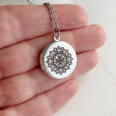 "Introducing my Mandala Locket Collection - a timeless piece of jewelry that is perfect for any occasion. As a symbol of the cosmos or universe, the entire design is symmetrical and balanced. Some spiritual traditions use mandalas for meditation or for marking a spiritual space. The word mandala itself simply means \"circle\" in Sanskrit. This silver plated brass locket is a small size, measuring 20mm in diameter. It opens up to reveal a secret place where you can store your most cherished photo Etched Pendant Locket Necklace As A Gift, Bohemian Sterling Silver Locket, Spiritual Round Pendant Locket Necklace Gift, Spiritual Personalized Pendant Locket Necklace, Spiritual Round Locket Necklace, Personalized Spiritual Pendant Locket Necklace, Spiritual Sterling Silver Medallion Locket Necklace, Adjustable Engraved Spiritual Locket Necklace, Spiritual Locket Necklace For Keepsake