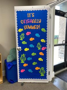 a door decorated with an ocean theme and saying it's osishally summer