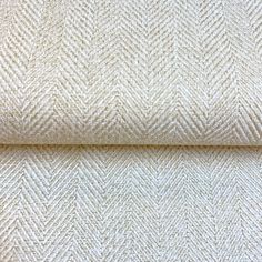 an upholstered fabric with white herringbones