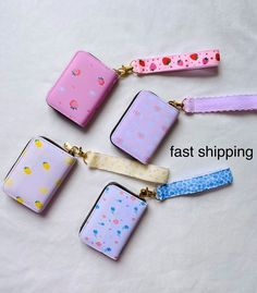 four zippered purses with different designs on them and the words fast shipping written below