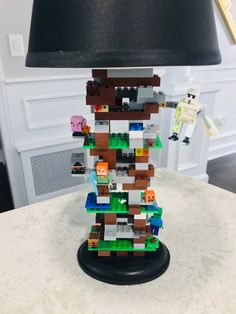 a lamp made out of legos sitting on top of a table