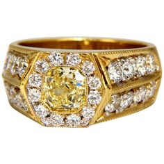 Men's Cushion cut diamonds, Micro Bead Set Ring. Intricate Craftsmanship, Hexagon Deck. GIA Certified 1.05ct. natural cushion cut center diamond. Fancy Yellow / VVS-1 clarity. Report: 6232044103 Side round diamond Accents Total Weight: 1.90ct. vs-2 clarity / G-color Natural, Earth Mined. 18kt. yellow gold 17.3 grams. Deck of ring: 10mm diameter Depth: 5.7mm current ring size: 8.5 We may resize, please inquire $35,000 Appraisal Certificate & GIA Certifiecate Luxury Yellow Gold Men's Ring With Brilliant Cut, Luxury Yellow Gold Statement Men's Ring, Luxury Men's Yellow Gold Ring With Brilliant Cut, Luxury Vintage Diamond Men's Ring, Luxury Men's Jewelry With Halo Setting, Luxury Antique Men's Diamond Ring, Luxury Yellow Gold Men's Ring With Diamond Cut, Luxury Men's Yellow Gold Cubic Zirconia Ring, Luxury Gia Certified Men's Jewelry