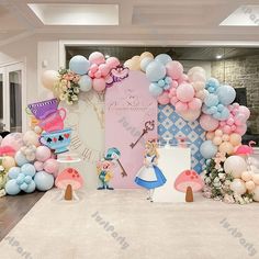 an entrance decorated with balloons and princess characters