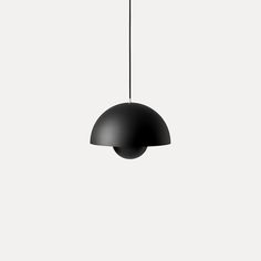 a black lamp hanging from the ceiling