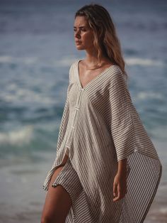 Make a memorable statement by the sea ​or in the lounge with the hand loomed Ava kimono. An asymmetric frayed hem along with side slits, add movement and flow to a roomy drape. Featured artisanal striped motifs woven into its flowy fabric which boasts a linen-like feel. Breathable fibers and naturally built-in cooling properties make this the perfect beach kaftan. How to wear it:​ This stand-alone piece can be pulled over a swimsuit or worn over shorts. - V-neckline - Frayed & asymmetric hem - S Beach Kaftan, Beach Kimono, Flowy Fabric, The Lounge, Pearl Jewellery Earrings, August Birth Stone, Independent Designers Fashion, By The Sea, Gifts For New Moms