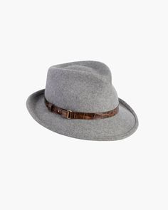 This water-repellent wool-felt fedora is perfect for those who don't want too many hats. The abbreviated brim looks snappy and is reminiscent of mannish hats from the 1950s. This wardrobe staple has an adjustable band of embossed calf leather with antique hardware. The Crown is lined. The elasticized inner band fits most. Imported. Brim Span: 2.5" Winter Fedora With Short Brim In Fur Felt, Adjustable Wool Cloche Hat With Flat Brim, Fur Felt Fedora With Short Brim For Winter, Fall Short Brim Fur Felt Hat, Formal Wool Felt Hat For Winter, Adjustable Fur Felt Cloche Hat With Flat Brim, Fall Fur Felt Hat With Short Brim, Fur Felt Hat With Short Brim For Fall, Adjustable Wool Top Hat With Flat Brim