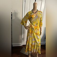 Details: Vintage V Neckline With 3/4 Sleeves Full Wrap Dress With Two Inserts To Tie On Either The Right Or Left Side. Vibrant Colors That Highlights This Dress. Single Ruffle Hem And Very Lightweight Fabric That Is Soft To The Touch. Material: 100 Percent Polyester Unbranded - New In Packaging Fitted V-neck Maxi Dress For Daytime, Spring Yellow Floral Print Midi Dress, Yellow Sundress Maxi Dress For Spring, Yellow Sundress Maxi For Spring, Yellow Floral Print Maxi Dress For Daytime, Yellow Spring Maxi Dress For Daywear, Spring Yellow Maxi Dress For Daywear, Yellow Maxi Dress For Spring Daywear, Yellow Flowy Maxi Dress For Daytime