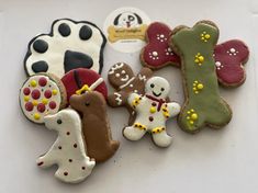 some decorated cookies are laying on a table