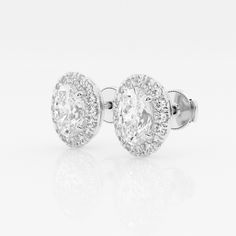 These imperial looking oval stud earrings are one of our best sellers. Large oval cut lab grown diamonds with a halo of round diamonds are a true amalgamation of style and glamor. Oval Stud Earrings, Diamond Halo, Halo Diamond, Oval Cut, Lab Grown, Lab Grown Diamonds, Round Diamonds, Best Sellers, Halo