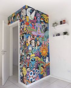 a wall covered in lots of cartoon characters and flowers next to an open white door