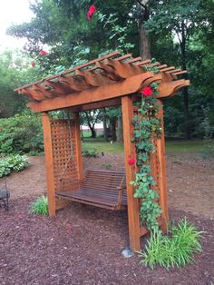 a wooden bench sitting in the middle of a park