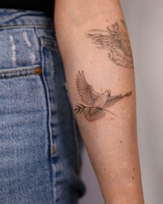 a woman with a tattoo on her arm