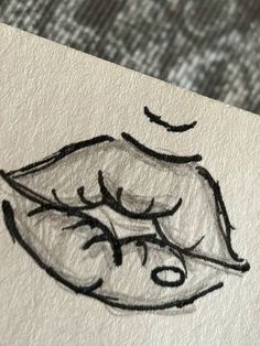 a drawing of a woman's lips on paper