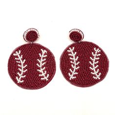 "NEW game day earrings are handmade beaded baseball earrings, perfect for adding a pop of team spirit to your ensemble.  These lightweight earrings feature a circular design with intricate beadwork on the front only in a vibrant hue of crimson/burgundy/maroon, adorned with white accents that mimic the classic stitching of a baseball.  Each pair is meticulously constructed with high-quality beads, ensuring durability and comfort for all-day wear.  The earrings come equipped with a stud fastening Burgundy Earrings, Baseball Jewelry, Baseball Earrings, Circular Design, New Game, Lightweight Earrings, White Accents, Light Weight Earrings, Team Spirit