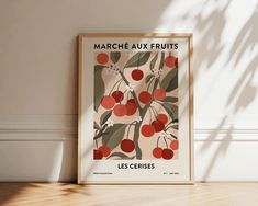 a framed poster with the words march aux fruits on it in front of a white wall