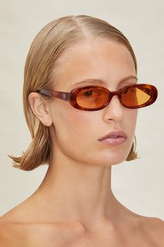 The Lima are polarized, ‘90s inspired, oval sunglasses with light tortoise, translucent frame and light orange lenses. Sunglass case and cleaning cloth included. Sunglasses Ss23, Devon Windsor, 90s Sunglasses, Model Sunglasses, Tortoise Glasses, Mens Measurements, Tortoise Sunglasses, Cool Sunglasses, Oval Sunglasses