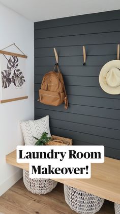 a wooden bench sitting next to a wall with hats hanging on it's hooks