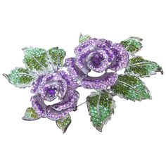 Stunning massive glittering crystal rose theme brooch The huge scale brooch is designed with a pair of three dimensional crystal rose buds in pastel hues of lavender and amethyst color glass The edges of the brooch are designed with sinuous leaves encrusted with mint green and moss green gleaming crystals The clusters of brilliant crystals are embedded in silver plated rhodium metal Makes a very dramatic show stopping accessory pinned on a jacket or coat lapel. It too makes a spectacular accessory adorned on an evening gown Measures 6.5 by 4.5 inches across the furthest points Image # 4 is paired with a US dime coin for size reference Broche Chanel, Rosé Theme, Crystal Stone Jewelry, Rose Brooch, Purple Jewelry, Amethyst Color, Red Jewelry, Rose Jewelry, Crystal Rose