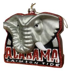 an ornament shaped like an elephant with the words alhama on it