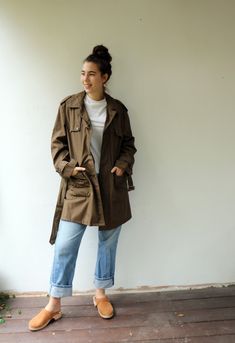 "Vintage trench coat in brown khaki military-style, short length, original belt attach, pockets, buttons down the front- upper button is missing, original tag intact, fully lined in gold satin. aside from minor signs of wear, very good vintage condition clean ready to wear. The model is 5'8\" and size S/M for reference. Tag size: 48 Approximate size: O.S- please refer to the measurements M E A S U R E M E N T S -were taken with garments laying flat, please double where necessary. --------------- Retro Khaki Utility Jacket With Pockets, Khaki Cargo Style Outerwear For Work, Khaki Double-breasted Utility Outerwear, Brown Military Style Outerwear For Spring, Brown Military Style Outerwear For Work, Military Cargo Style Outerwear For Work, Vintage Khaki Utility Jacket For Spring, Vintage Khaki Outerwear For Spring, Brown Military Utility Jacket For Workwear