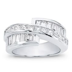 This channel set diamond band is set with 14 baguettes and 13 princess cut diamonds totaling 2.80cttw and is available in 14k, 18k, and platinum. Wedding Rings And Bands, Channel Set Diamond Band, Rings And Bands, Gorgeous Wedding Rings, Wedding Rings Princess Cut, Channel Set, Diamond Band, Princess Cut Diamonds, Ring Collections