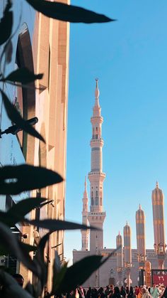 people are standing in front of a tall building