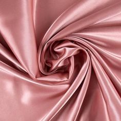 Add an element of elegance to your sewing creations with Dusty Rose Poly Satin Fabric! Featuring a light pink color and a sleek top surface, this fabric is fit for a wide range of creations. This simply stunning satin will make you shine with sophisticated style! Details: 	 Width: 58" 	 Weight: Very Lightweight 	 Country Of Origin: China 	 Content: 100% Polyester 	 Care: Machine Wash, Warm; Delicate Cycle; Tumble Dry, Low; Use Cool Iron. Do Not Bleach. 	 Flammability Note: Not For Sleepwear Avai Bath Inspiration, Dusty Rose Color, Wedding Color Palette, Light Pink Color, Satin Color, Wedding Mood, Pink Silk, Color Pallets, Rose Color