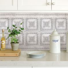 the kitchen counter is clean and ready to be used as a place setting for dinner