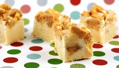 three pieces of cake sitting on top of a polka dot table cloth