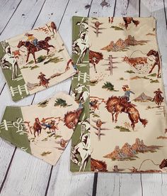 three placemats with horses on them sitting on a wooden floor next to each other