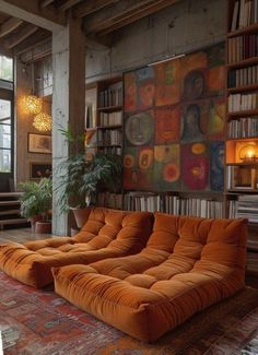 an orange couch sitting on top of a rug in a living room