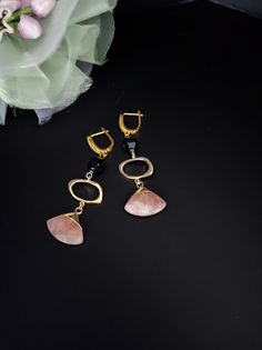 Strawberry quartz and black agate pendant earrings. The hooks are embellished with cubic zirconia and all metal components are premium quality, 18K gold plated. The earrings are long, simple but very elegant. Perfect for every day but also with a beautiful evening dress. You cannot miss the radiant beauty that emanates from these gemstones, it is truly dazzling, particularly when the light catches the facets and truly comes to life. Strawberry Quartz is delicious and energizing. It is a one of a kind stone that emits some amazing vibrations that are possibly life changing. The basic meaning of Strawberry Quartz is that it is the stone of love. The rosy pink crystal energy embraces you with thoughtful affection. The power of love can alter even the darkest situations. This stone has an exce Elegant Onyx Earrings, Modern Natural Stone Earrings For Formal Occasions, Elegant Onyx Earrings For Party, Onyx Earrings For Evening, Elegant Onyx Dangle Earrings, Gemstone Dangle Earrings For Evening, Elegant Gemstone Linear Earrings As Gift, Onyx Drop Earrings Jewelry Gift, Onyx Drop Earrings As A Gift